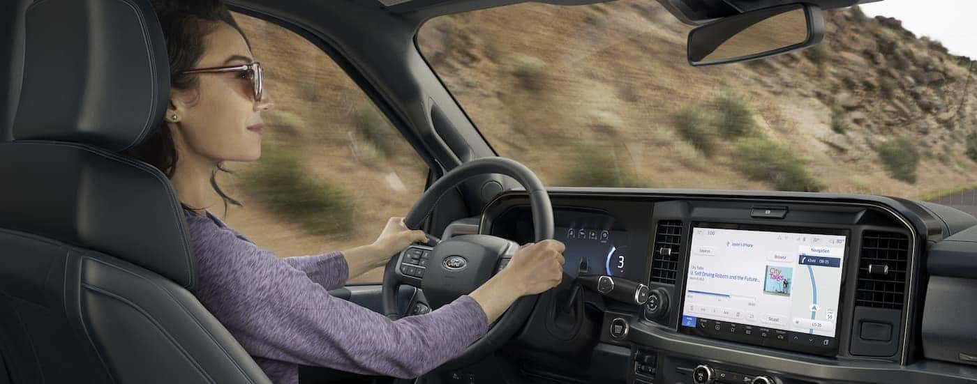 A person driving in a 2025 Ford F-250.