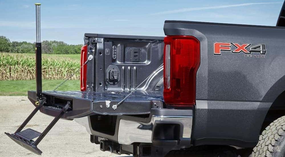 Close-up of the tailgate step on a gray 2025 Ford F-250 FX4.