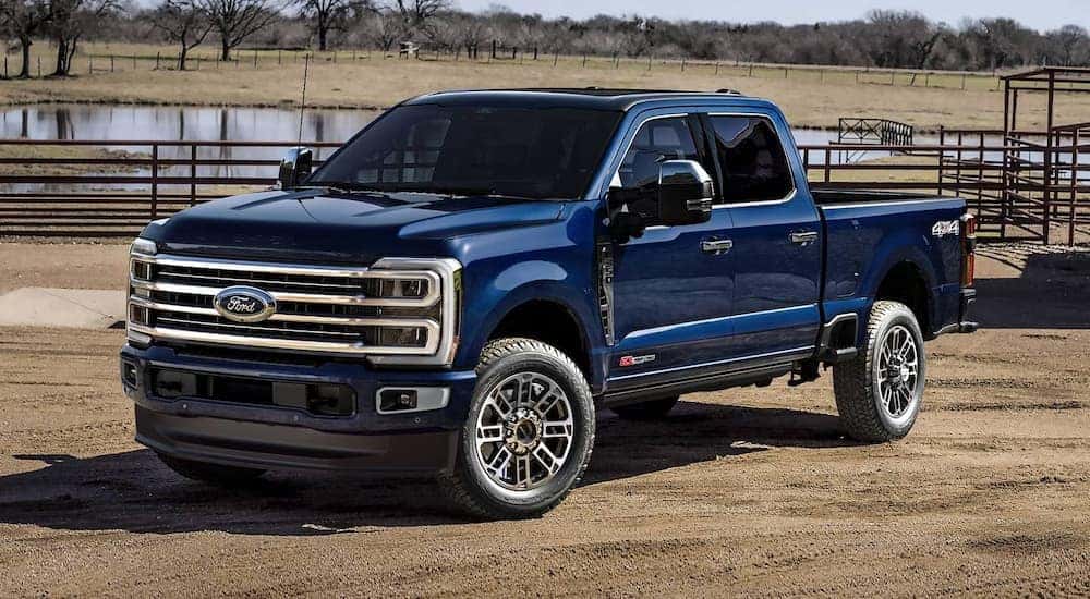 A blue 2025 Ford F-350 from a dealer vs a 2025 GMC Sierra 3500 HD