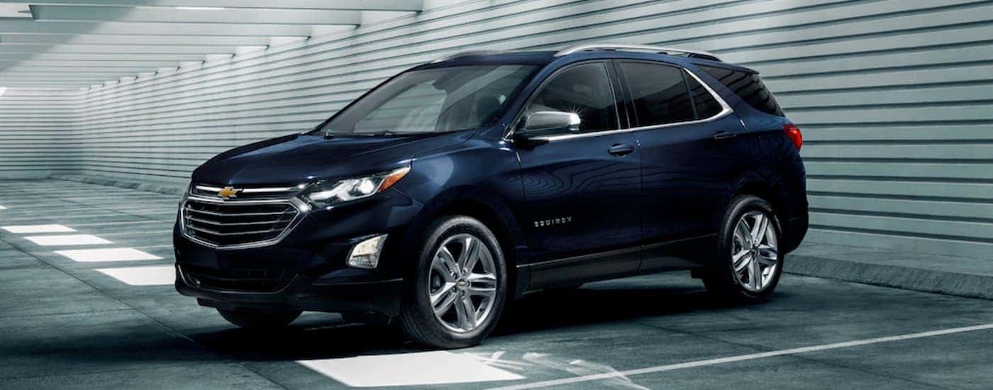 Black 2020 Chevy Equinox parked in a parking garage.