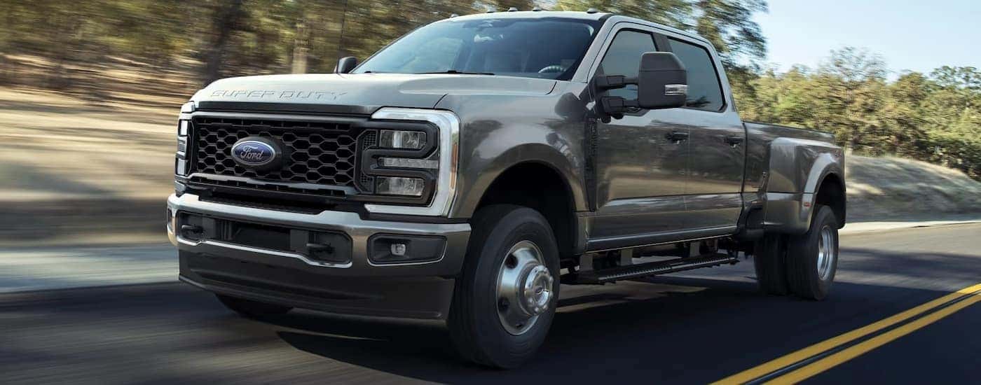 A gray 2025 Ford F-350 driving down a highway