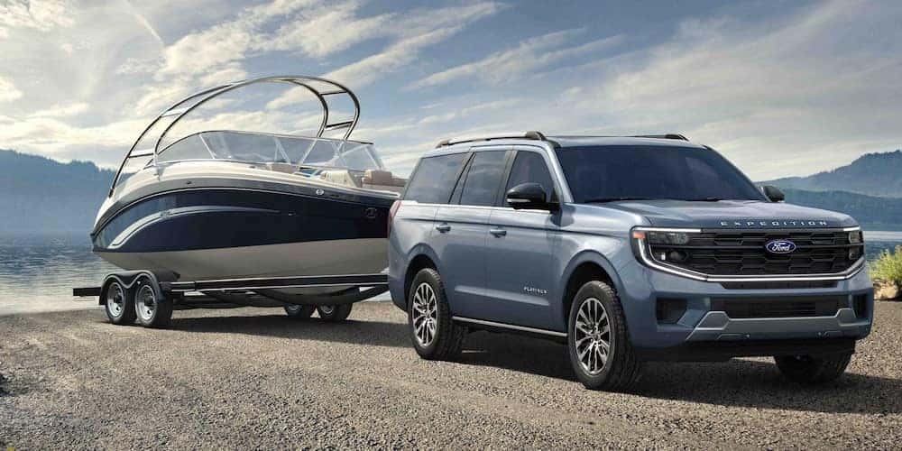 2025 Ford Expedition towing a boat.