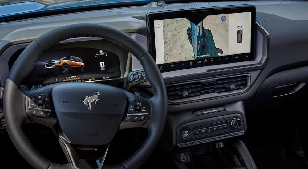 Black interior and infotainment system on a 2025 Ford Bronco Sport.