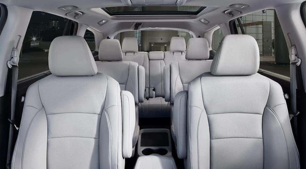Interior view of a 2020 Honda Pilot with white interior.