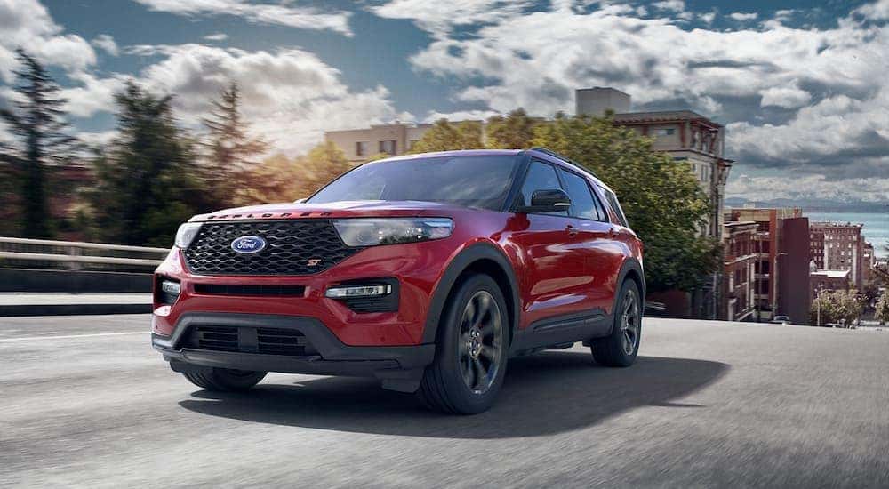 Front view at an angle of a red 2021 Ford Explorer ST one of the many used cars for sale near Halfmoon.