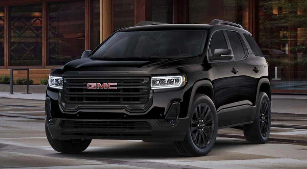 Front view at an angle of a black 2021 GMC Acadia.