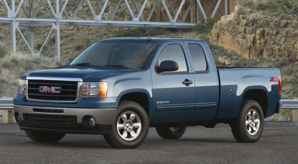Blue 2011 GMC Sierra 1500 Z71 from the front at an angle.