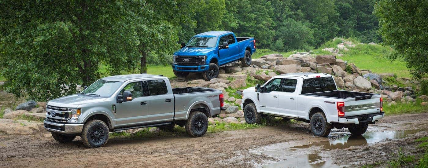 Three 2020 Ford Super Dutys parked off-road
