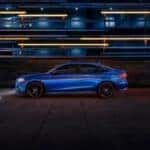 Blue 2022 Honda Civic driving to a used car dealer near Albany