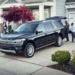 Blue 2023 Ford Expedition parked outside a home