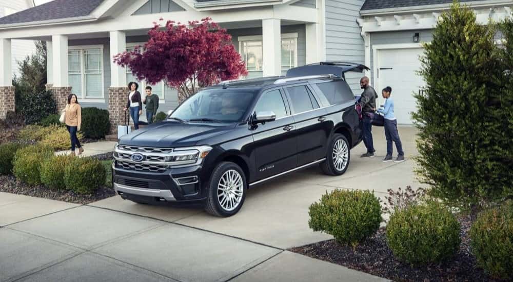 Blue 2023 Ford Expedition parked outside a home