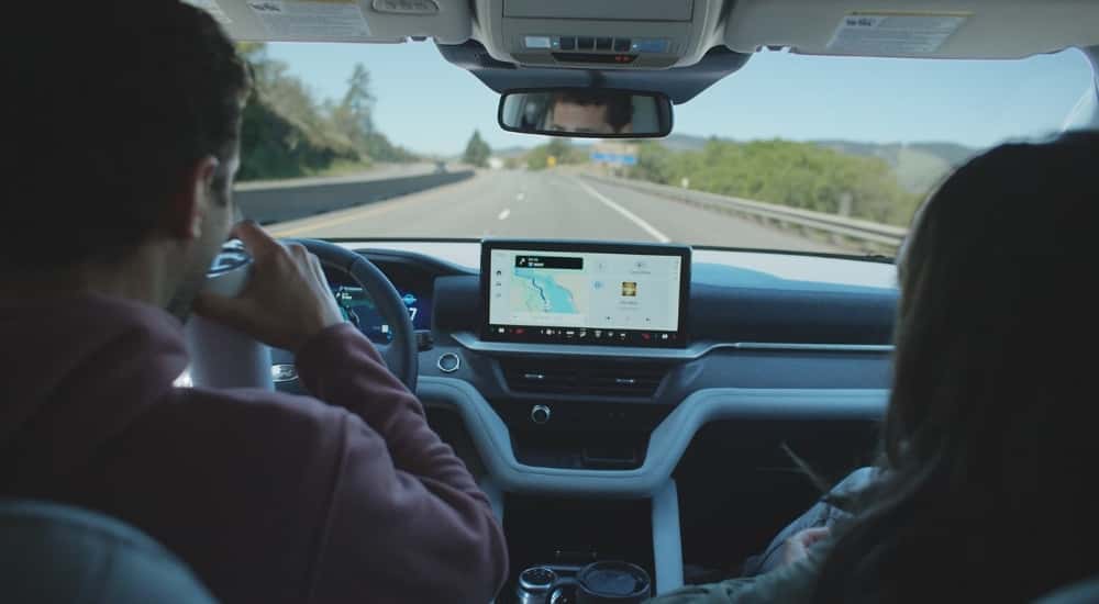 Interior view of a 2025 Ford Explorer driving down a highway