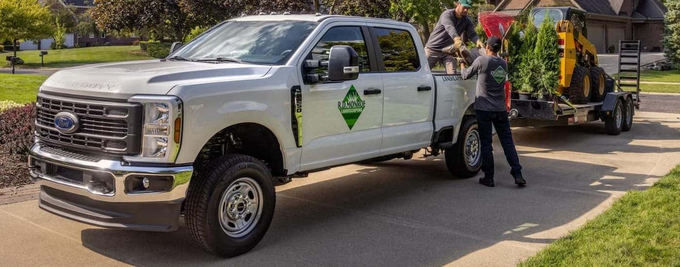 A white 2026 Ford F-250 parked on a driveway.