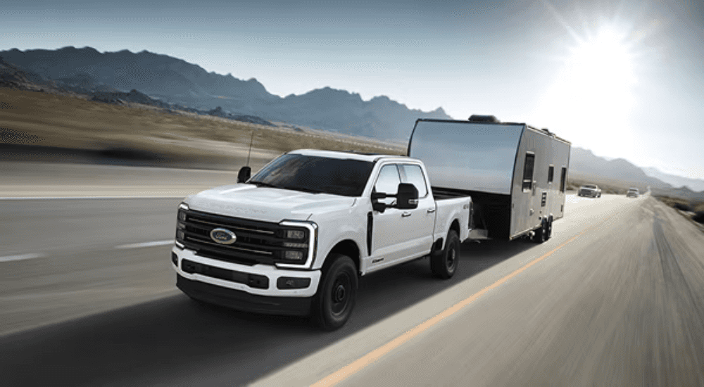 White 2026 Ford F-350 Platinum towing a trailer