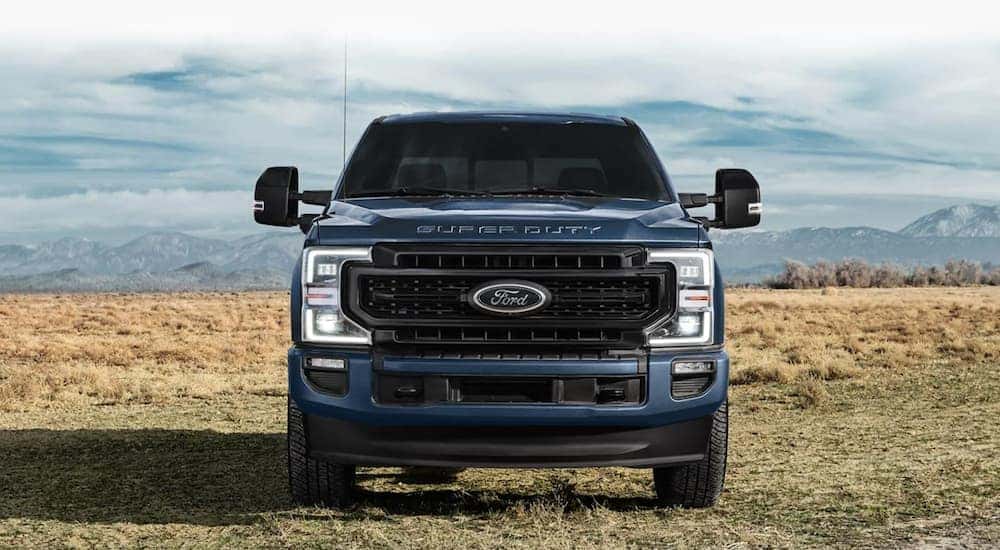 Blue 2021 Ford F-250 Super Duty parked on grass