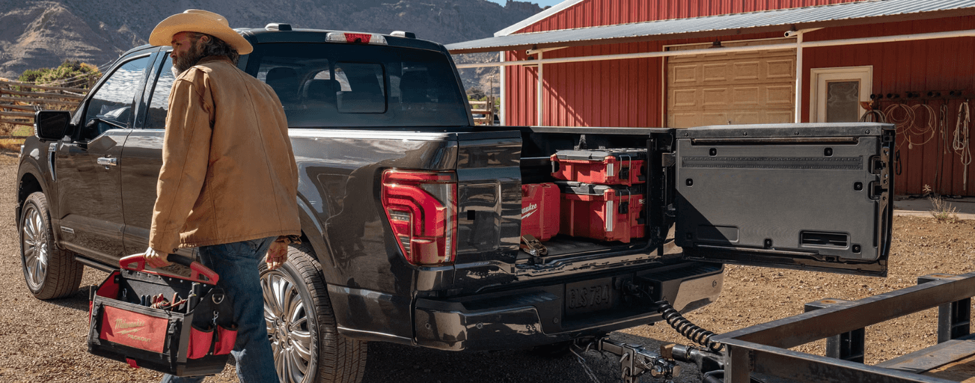 The pro access tailgate on a black 2025 Ford F-150 Lariat