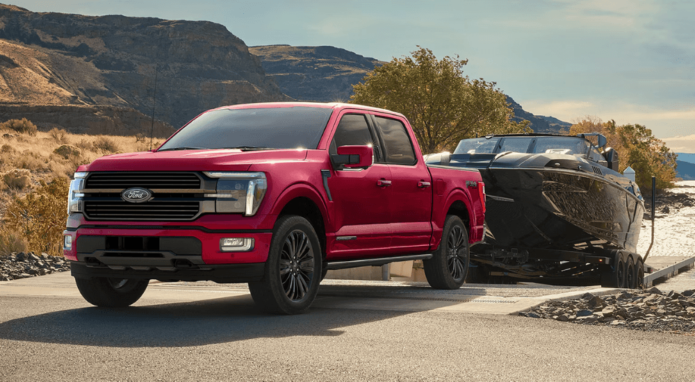 Red 2026 Ford F-150 for sale near Nassau towing a boat