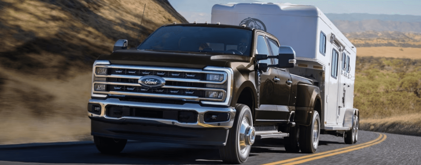 Brown 2026 Ford F-350 towing a trailer