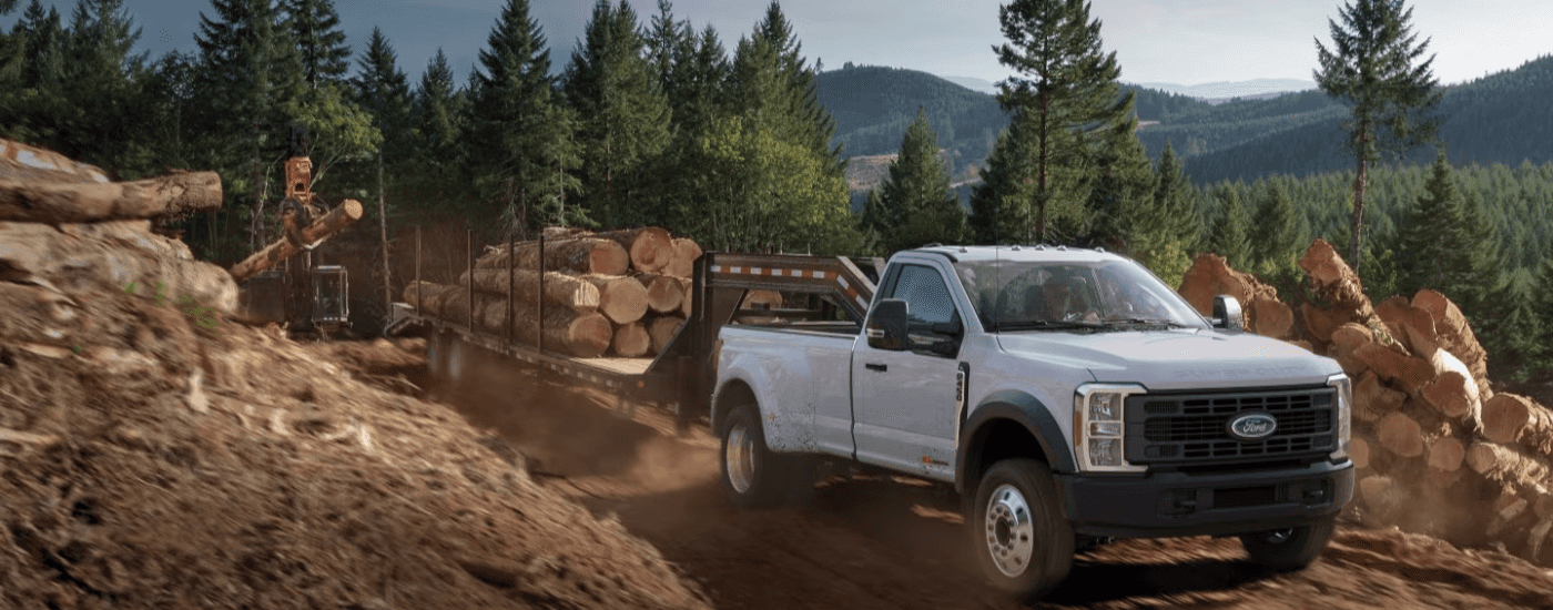White 2026 Ford F-450 towing lumber