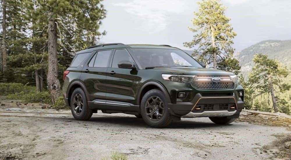 A black 2023 Ford Explorer Timberline parked off-road on a trail