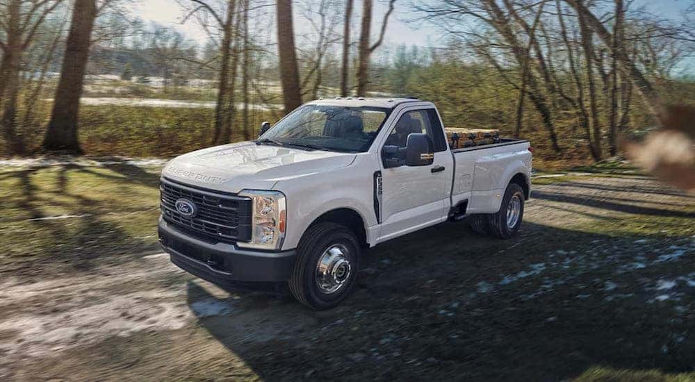 White 2026 Ford F-350 for sale near Troy driving off-road.