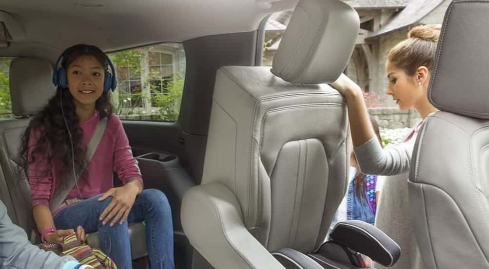 Children in a 2024 Ford Expedition parked near a used car dealer near Ballston Spa.