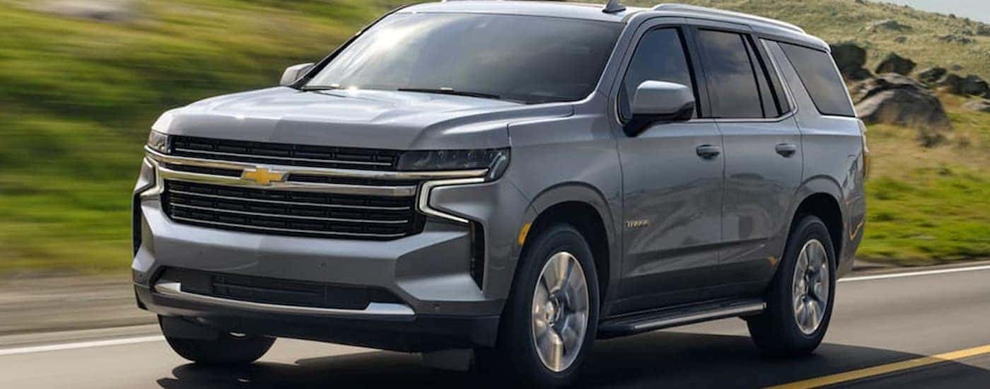 A gray 2021 Chevy Tahoe driving on a highway