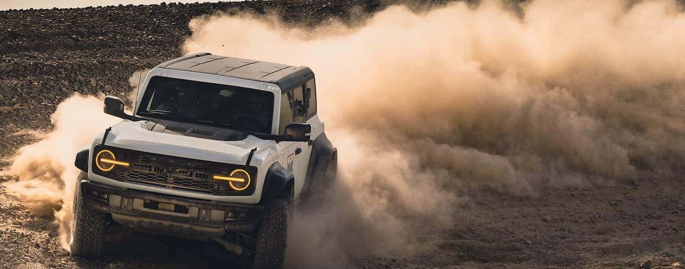 A white 2026 Ford Bronco off-roading in sand