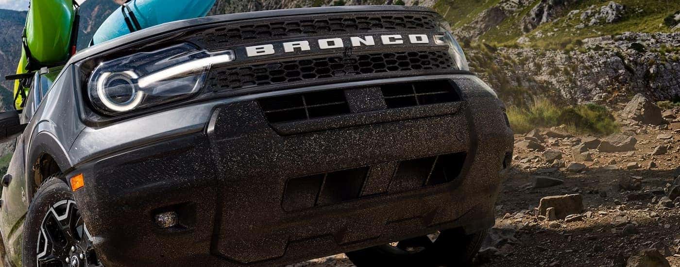 Close up of a grey 2026 Ford Bronco Sport off-roading on a hill