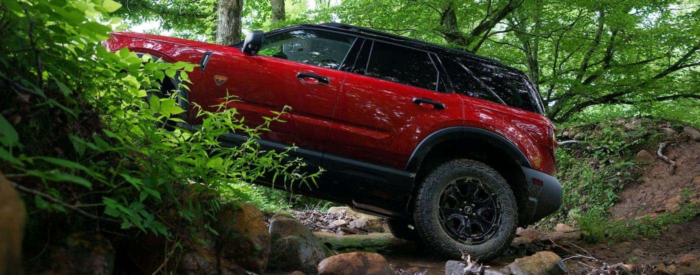 Side of a red 2026 Ford Bronco Sport off-roading