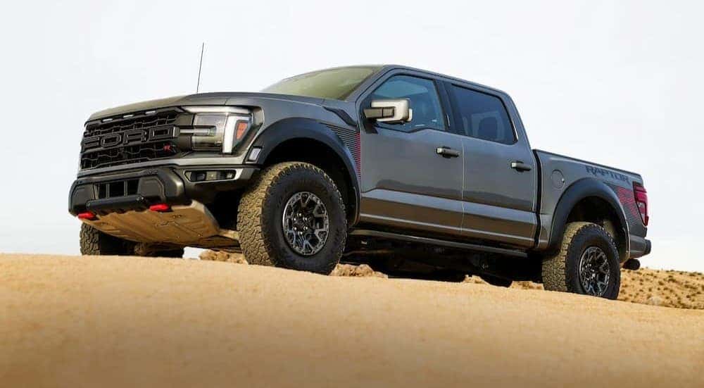 A gray 2026 Ford F-150 Raptor parked off-road.