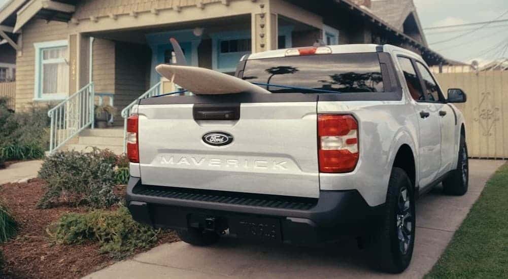 A white 2026 Ford Maverick parked in a driveway.