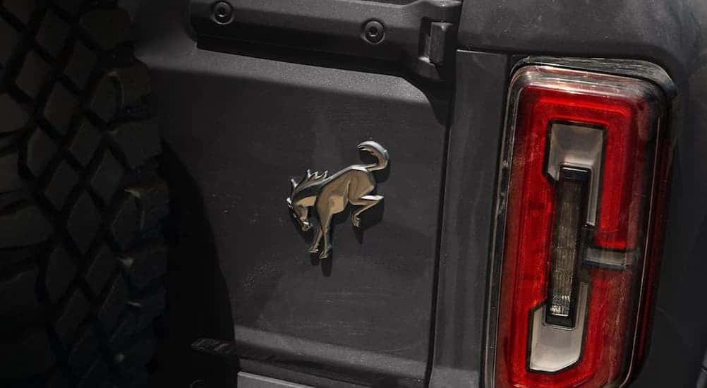 Close-up of the badge and taillight on a gray 2026 Ford Bronco Sport.