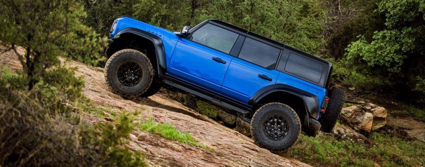 A blue 2025 Ford Bronco Raptor off-roading