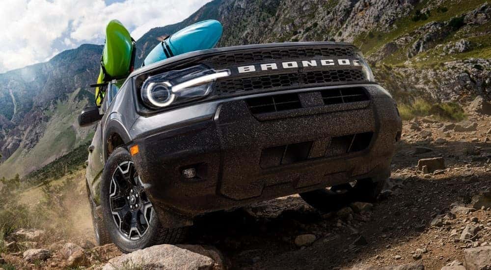 Silver 2026 Ford Bronco Sport off-roading with kayaks
