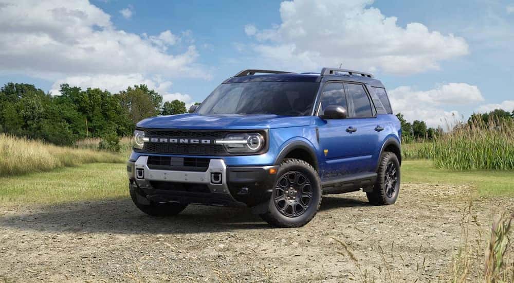 Blue 2026 Ford Bronco Sport parked off-road.