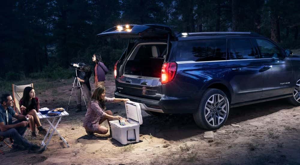 Black 2026 Ford Expedition MAX Platinum parked in the woods