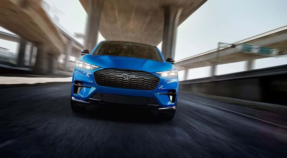 Blue 2026 Ford Mustang Mach-E GT edition driving down the freeway