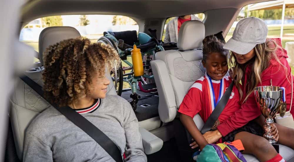 2026 Ford Explorer with passengers in the rear seats and a loaded cargo
