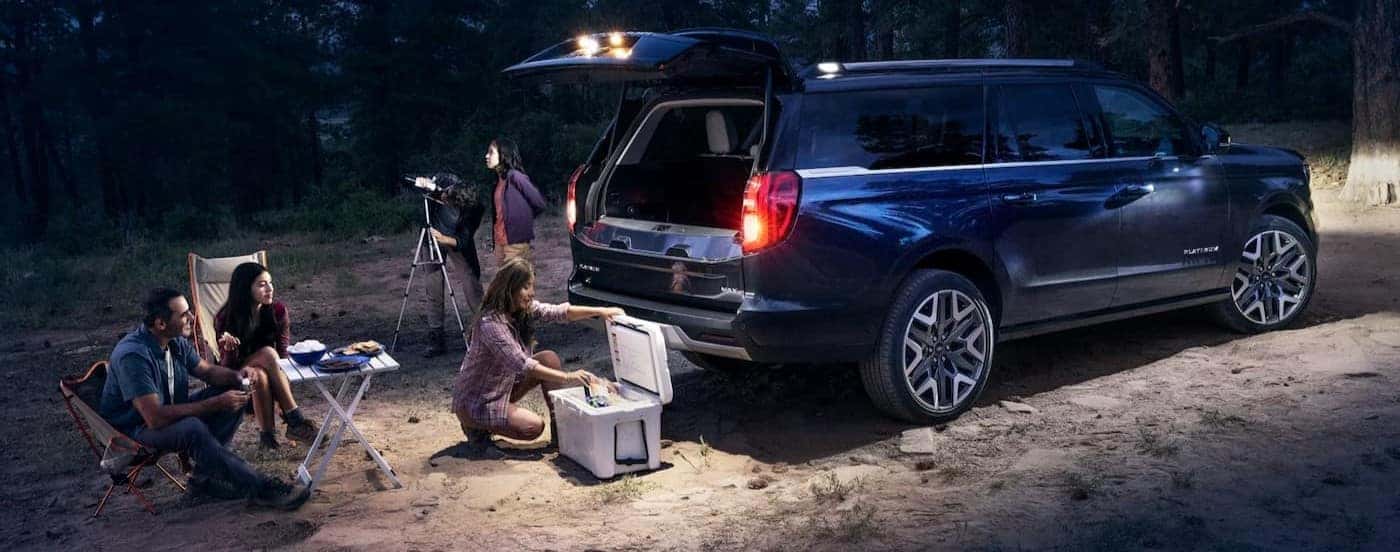 A blue 2026 Ford Expedition MAX parked at night.