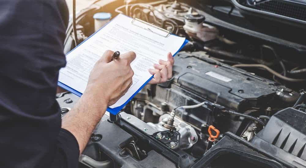 Mechanic carefully inspecting an engine