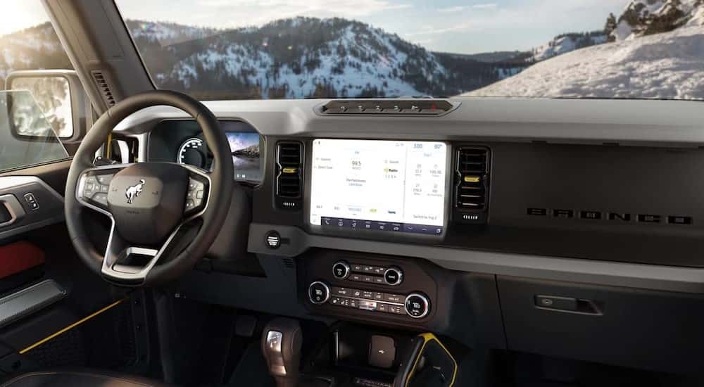 The front interior of a 2021 Ford Bronco with infotainment screen.