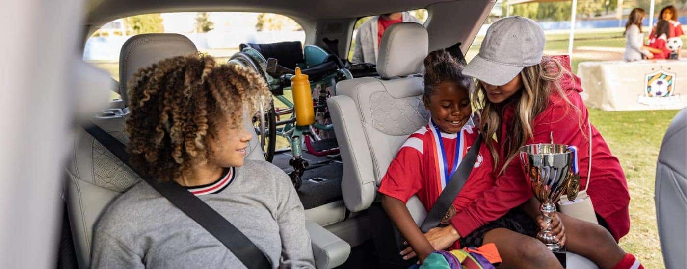 2026 Ford Explorer with passengers in the rear seats and a loaded cargo