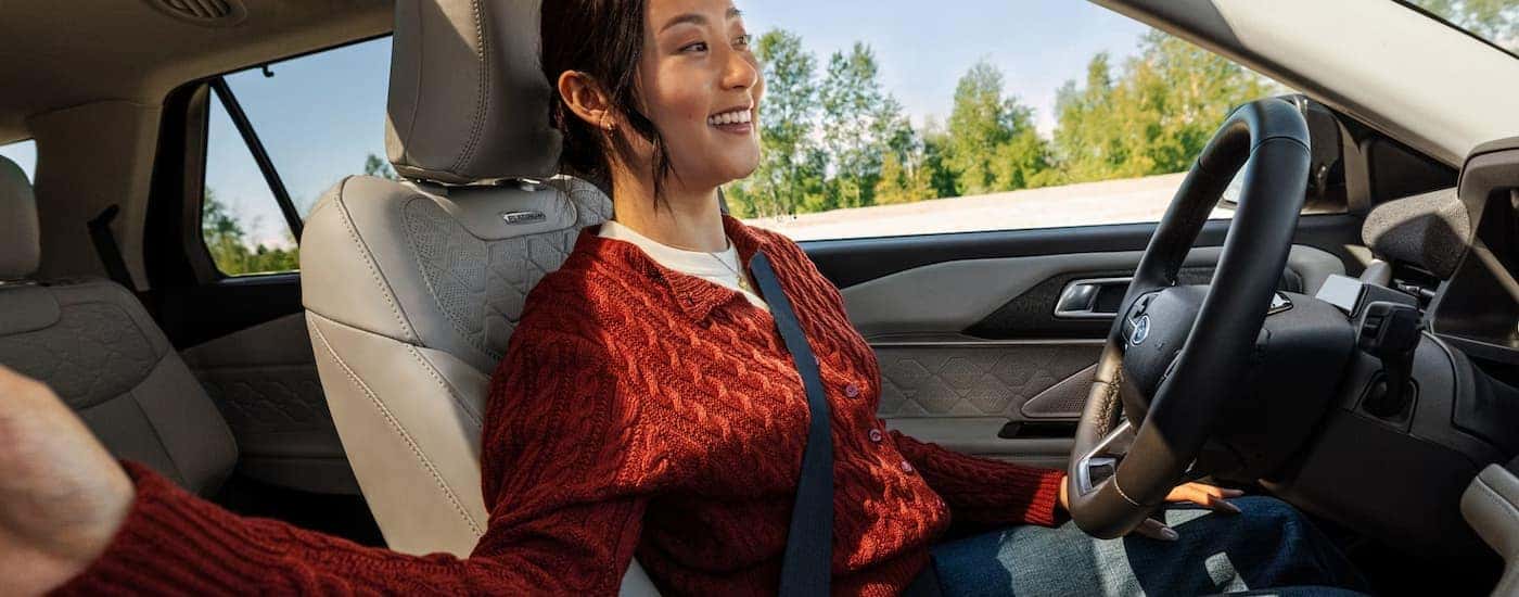 A woman using hands-free driving in a 2026 Ford Explorer
