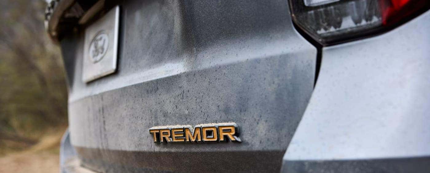 Tremor baade on the tailgate of a gray 2026 Ford Explorer Tremor