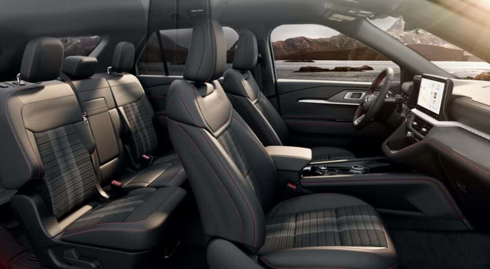 Interior view of a 2026 Ford Explorer parked by a lake.