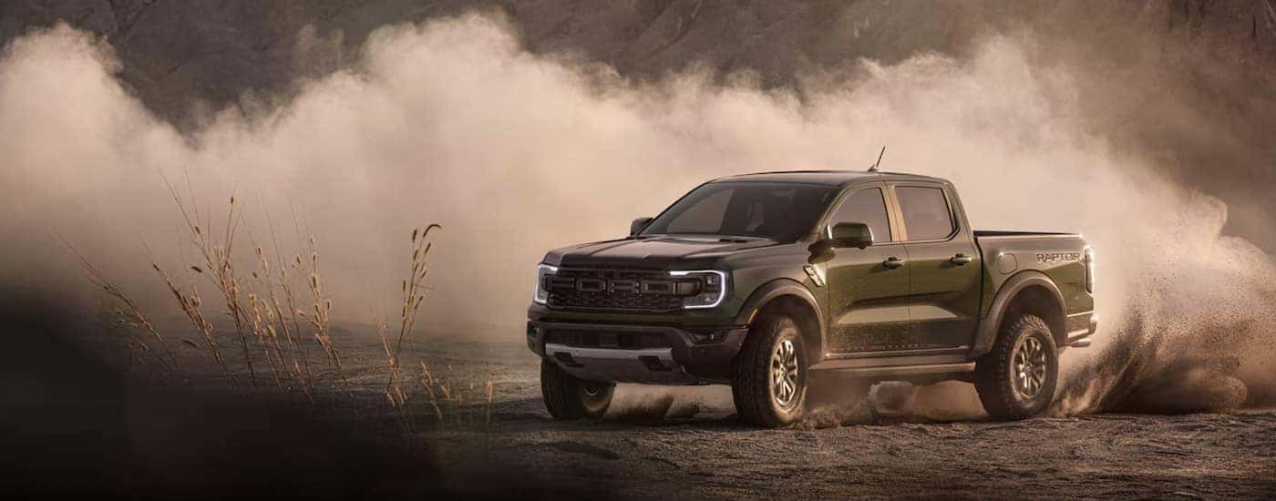 A black 2026 Ford Ranger off-roading in dirt