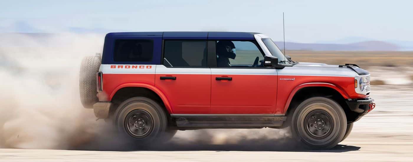 Red 2026 Bronco in the desert salt pan.