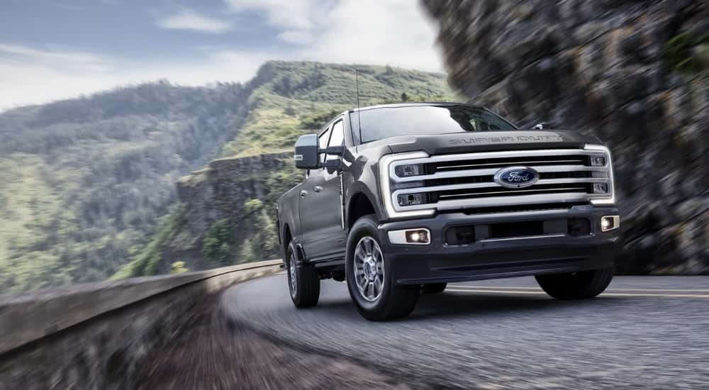 A gray 2026 Ford F-350 Platinum Plus turning a corner.
