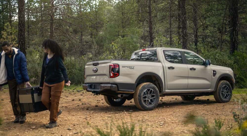 A tan 2026 Ford Ranger Sport 4X4 parked in the woods.